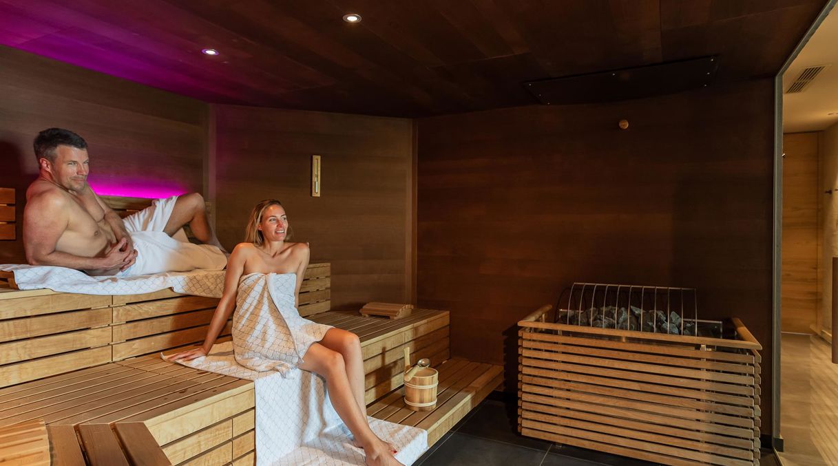 Two guests in the finnish sauna of our wellness hotel near Merano/Meran