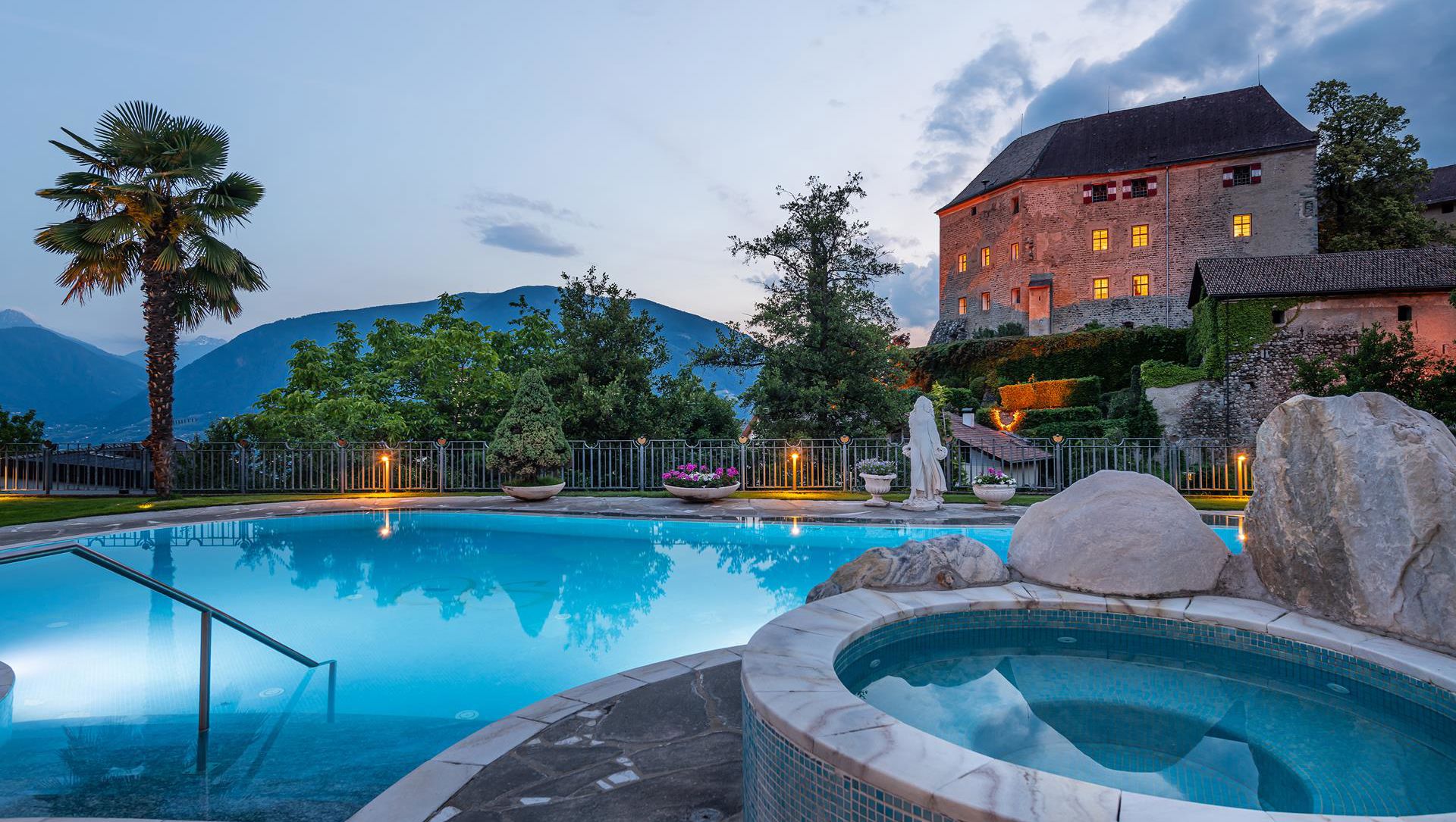 Outdoor pool and whirlpool of our hotel near Merano/Meran at evening