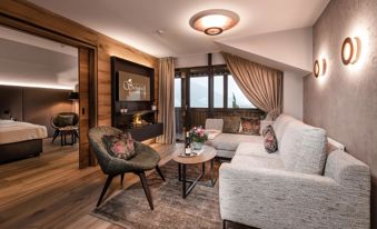 Suite Starkenberg with separate living room and bedroom, fireplace, and balcony